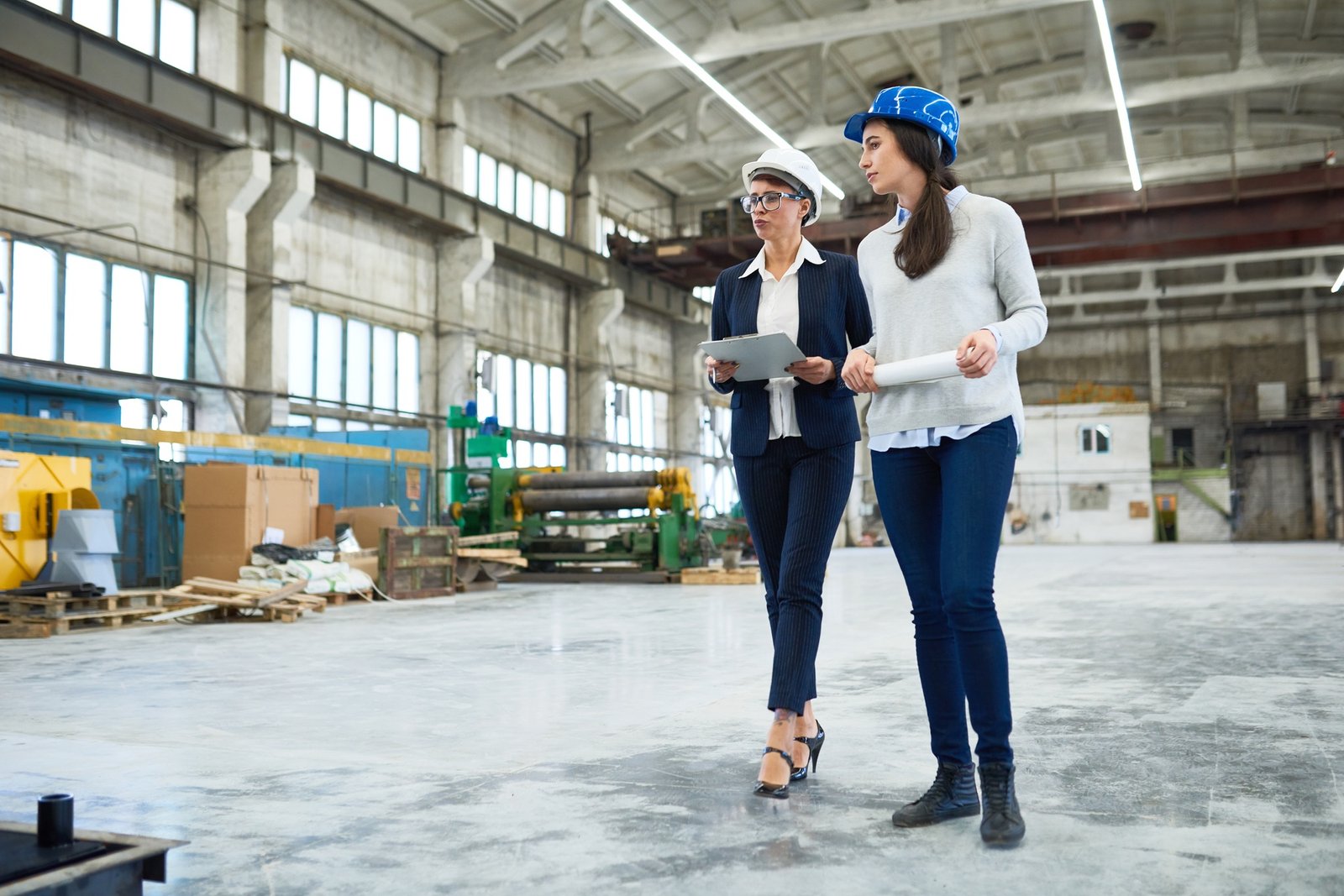 Female engineer holding factory tour for investor